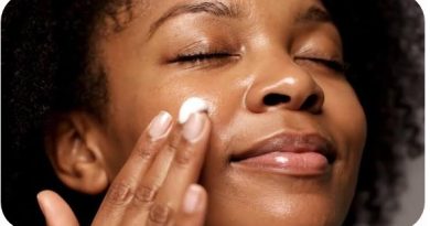 A woman applying a hydrating moisturizer cream to her face as part of a 5-minute hydrating skincare routine for glowing skin.